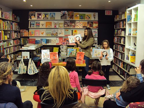 Children Reading Books With Parents